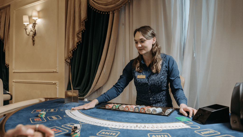 A person standing in front of a casino table