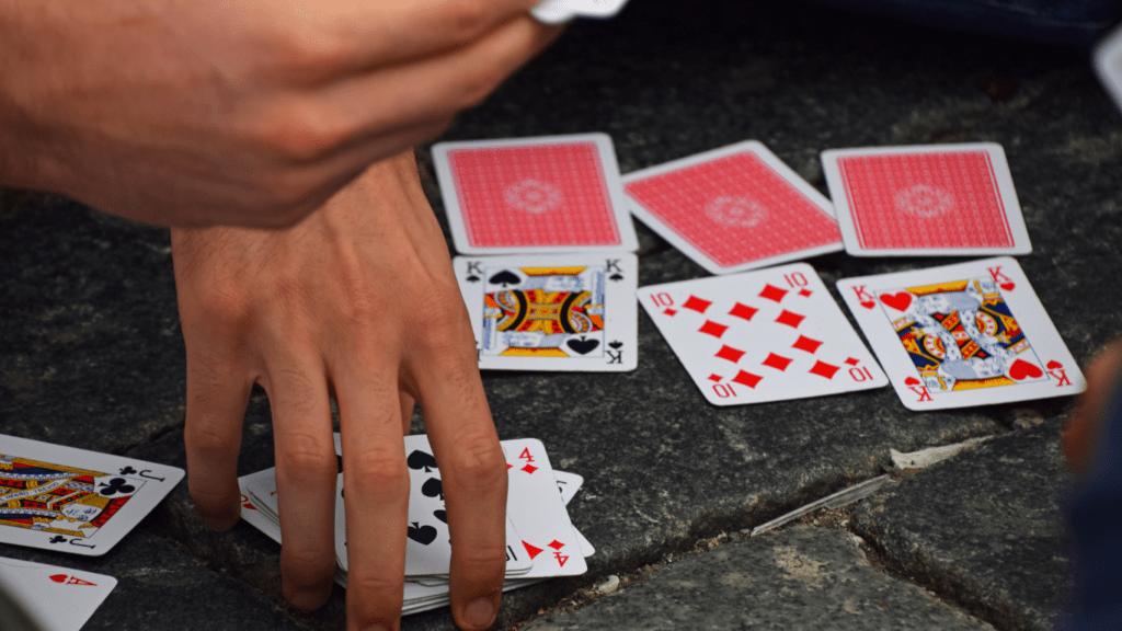 a group of people playing cards