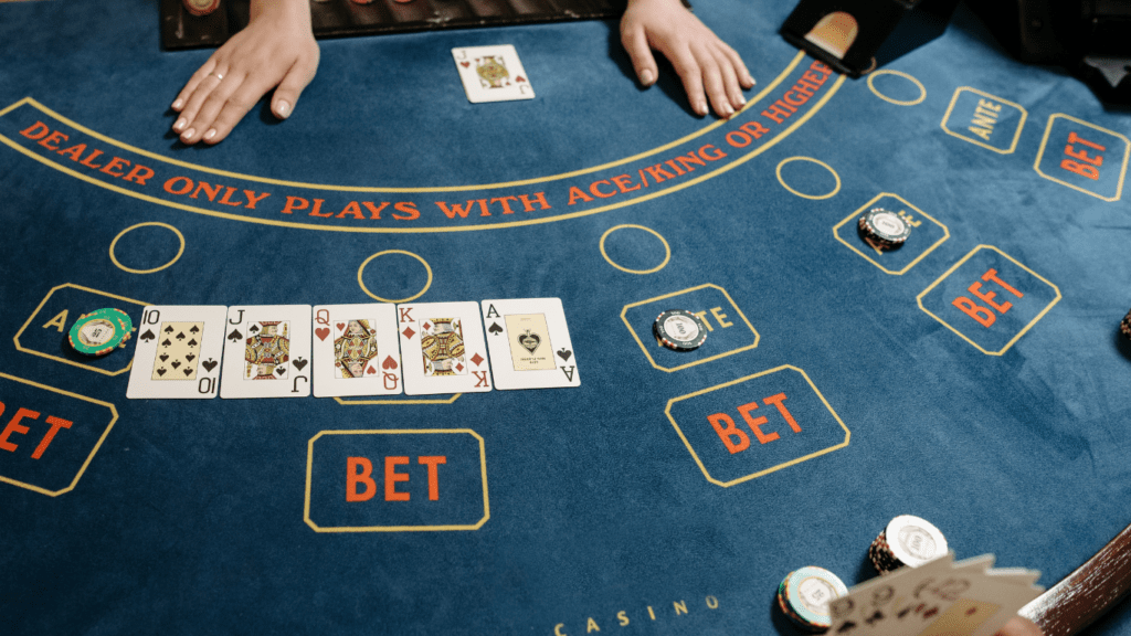 a casino table with people playing blackjack