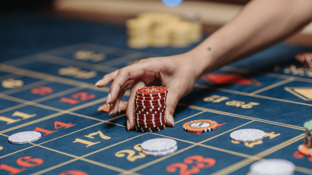 a person holding a poker chips