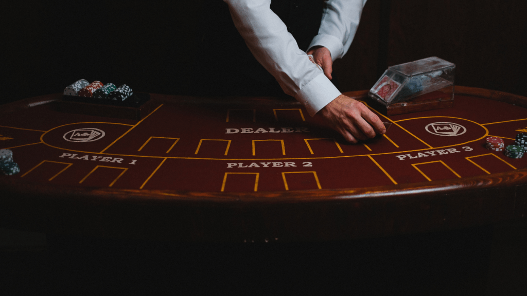 a blackjack table with cards and chips on it