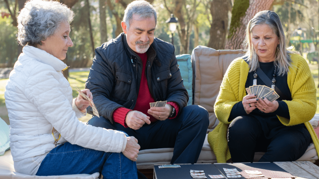 a group of people playing cards 