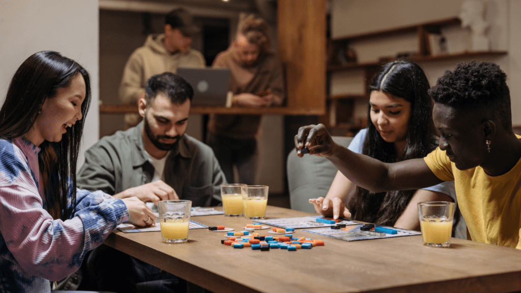 a group of people playing cards at a table