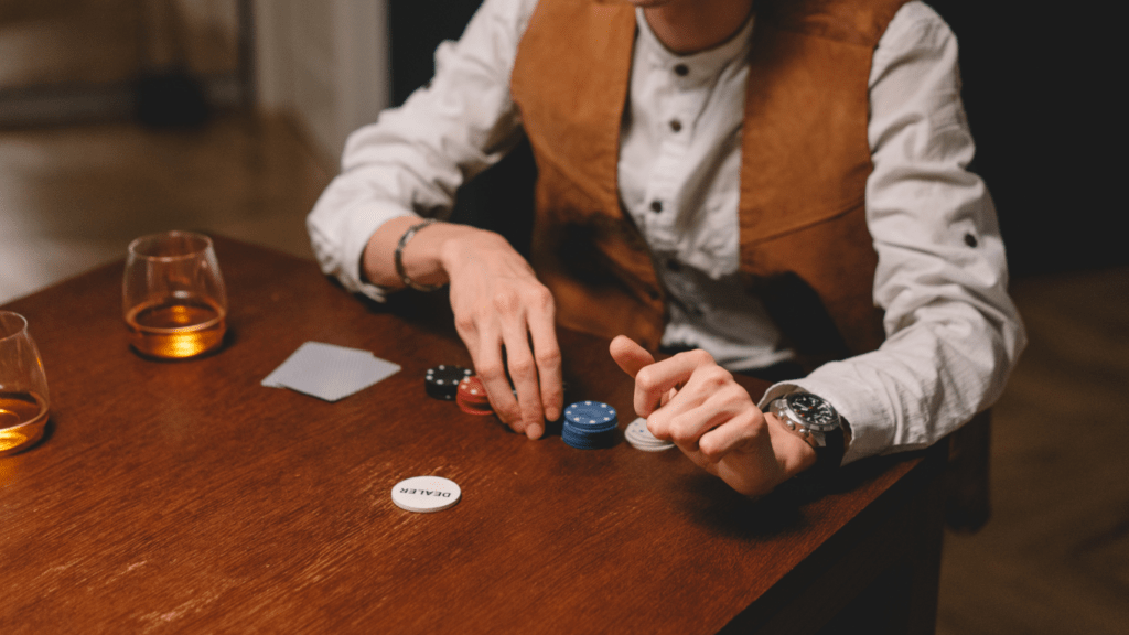 a person holding a poker chips