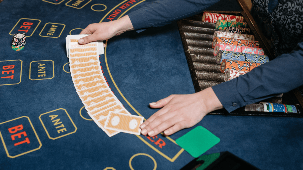 a person playing blackjack on a casino table