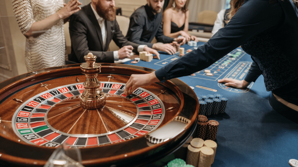 people playing roulette at a casino table